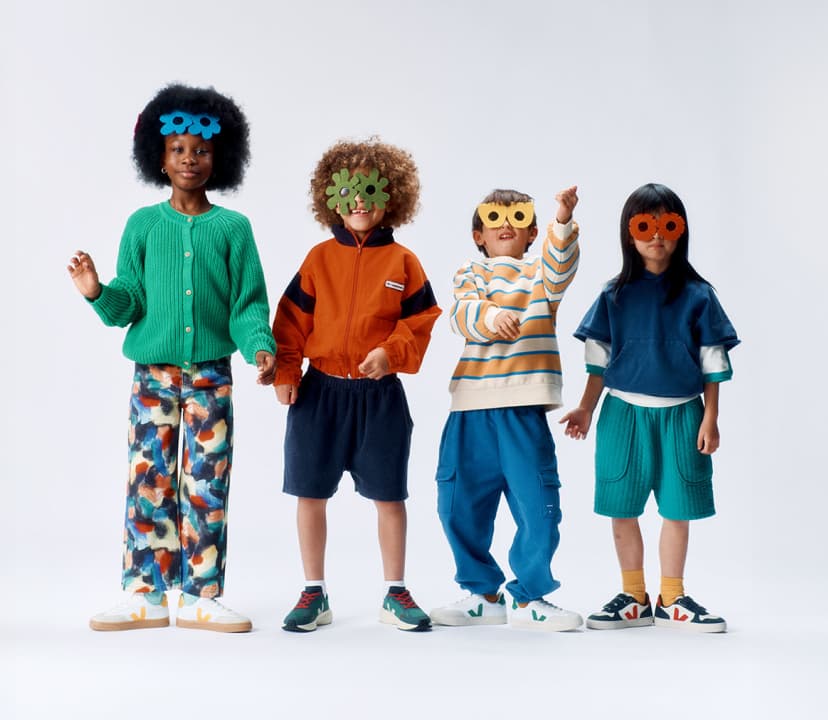 Four kids wearing Veja sneakers